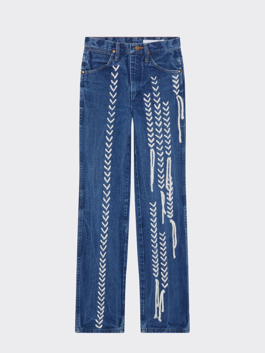 Send us your worn-out jeans and we’ll repair and upcycled them to give them a second chance in your wardrobe. We can embroider any pattern, any writing, or even paint artwork directly onto the jeans to create a style that is completely unique to you. Produced by Fanfare Label, a contemporary sustainable womenswear brand.