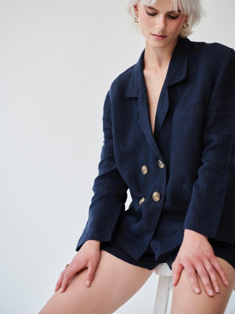 Double breasted Ethically Made Navy Linen Suit with shorts and a high waist. Made by ethical clothing brand Fanfare Label