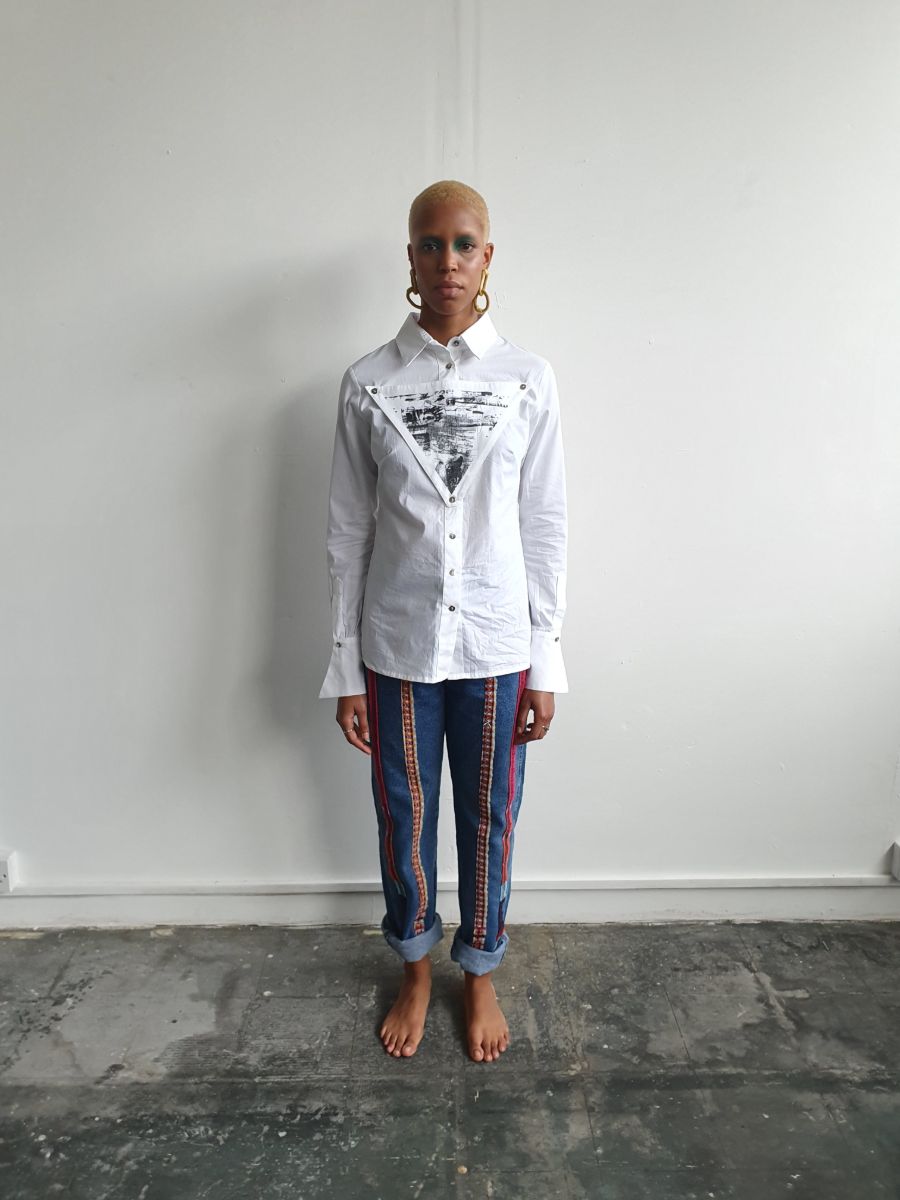 Organic Cotton White Shirt made in the UK by sustainable women's clothing brand Fanfare. This white shirt is long line, slim fit & has a detachable black printed triangle on the front.