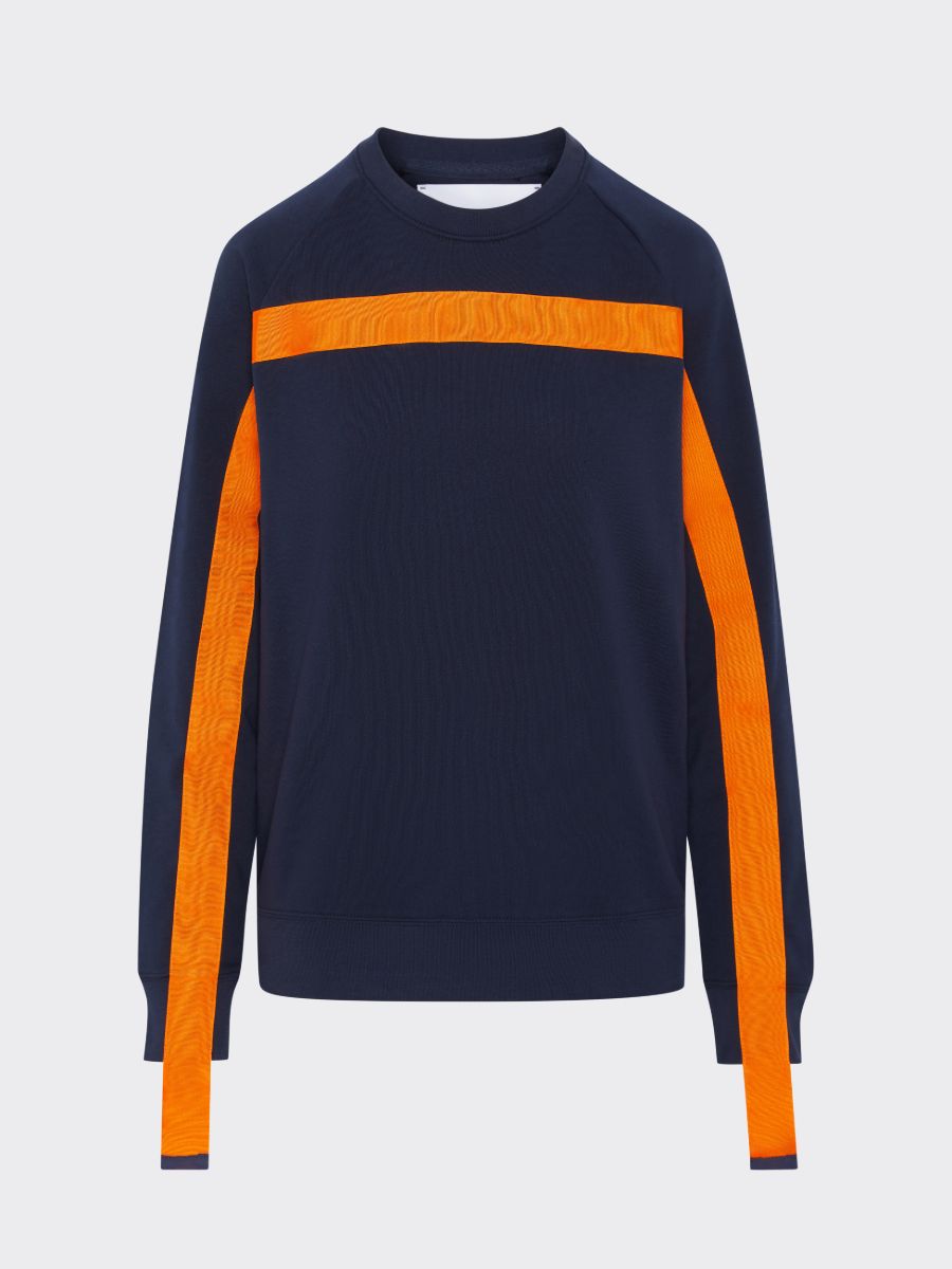 100% Gots certified organic cotton jumper in navy with an orange stripe across the chest & down the arms. Made by sustainable clothing brand Fanfare Label.