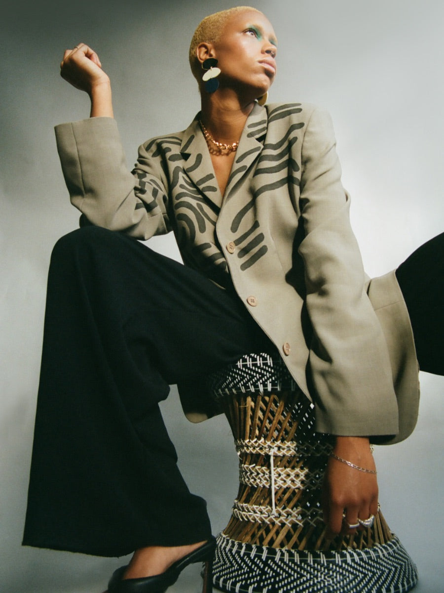 This recycled oversized green blazer has been hand painted with black textile paint for an unique effect. Sustainably made in the UK by Fanfare Label.
