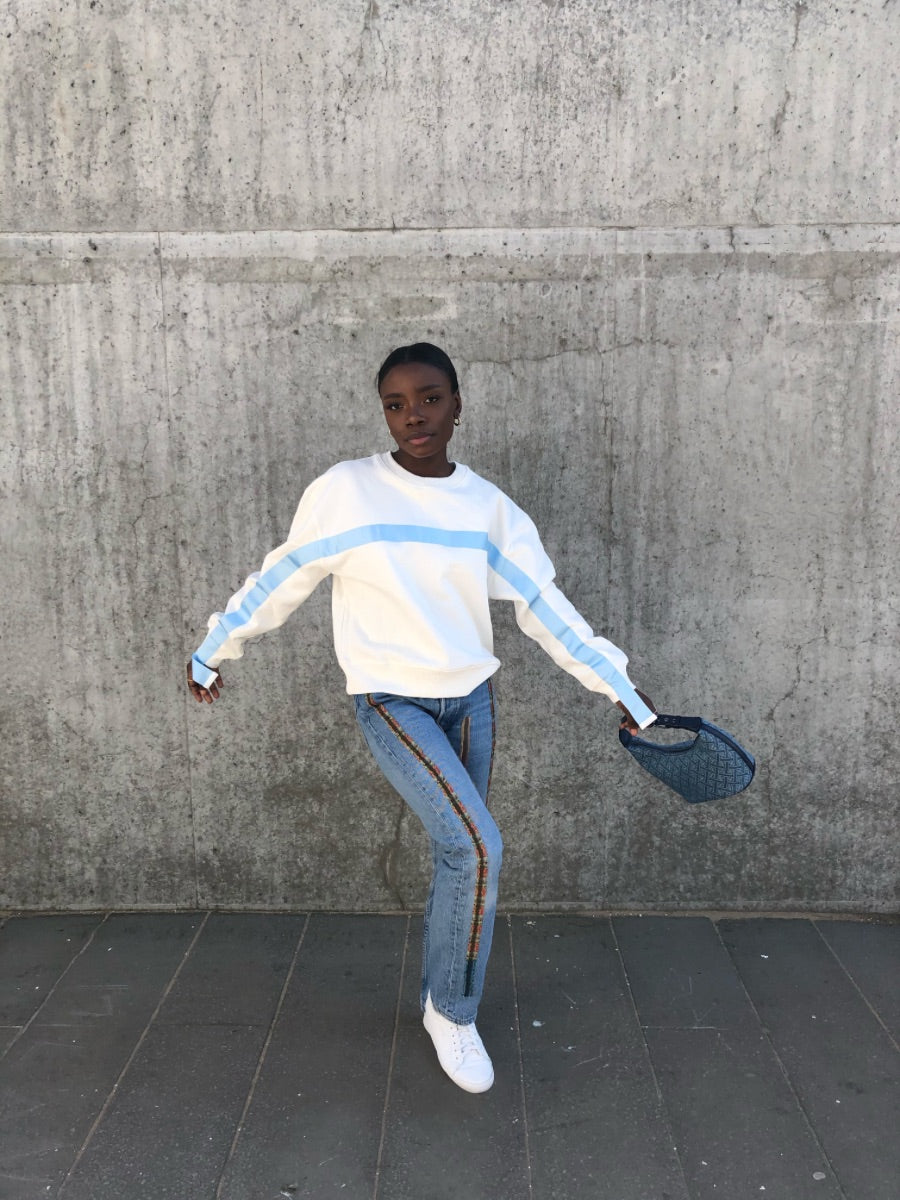 100% Gots certified organic cotton jumper in white with an blue stripe across the chest & down the arms. Made by sustainable clothing brand Fanfare Label.