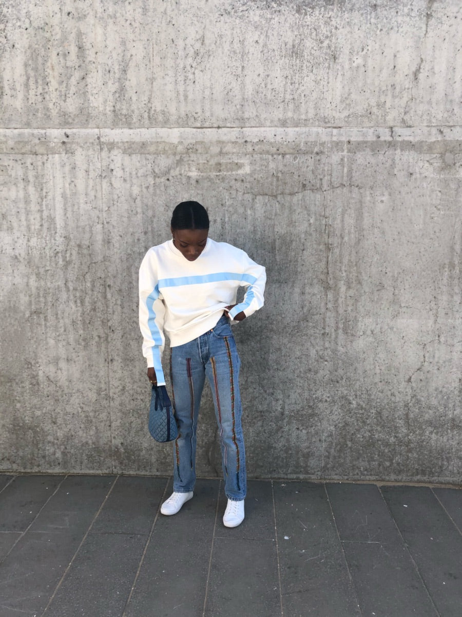 100% Gots certified organic cotton jumper in white with an blue stripe across the chest & down the arms. Made by sustainable clothing brand Fanfare Label.