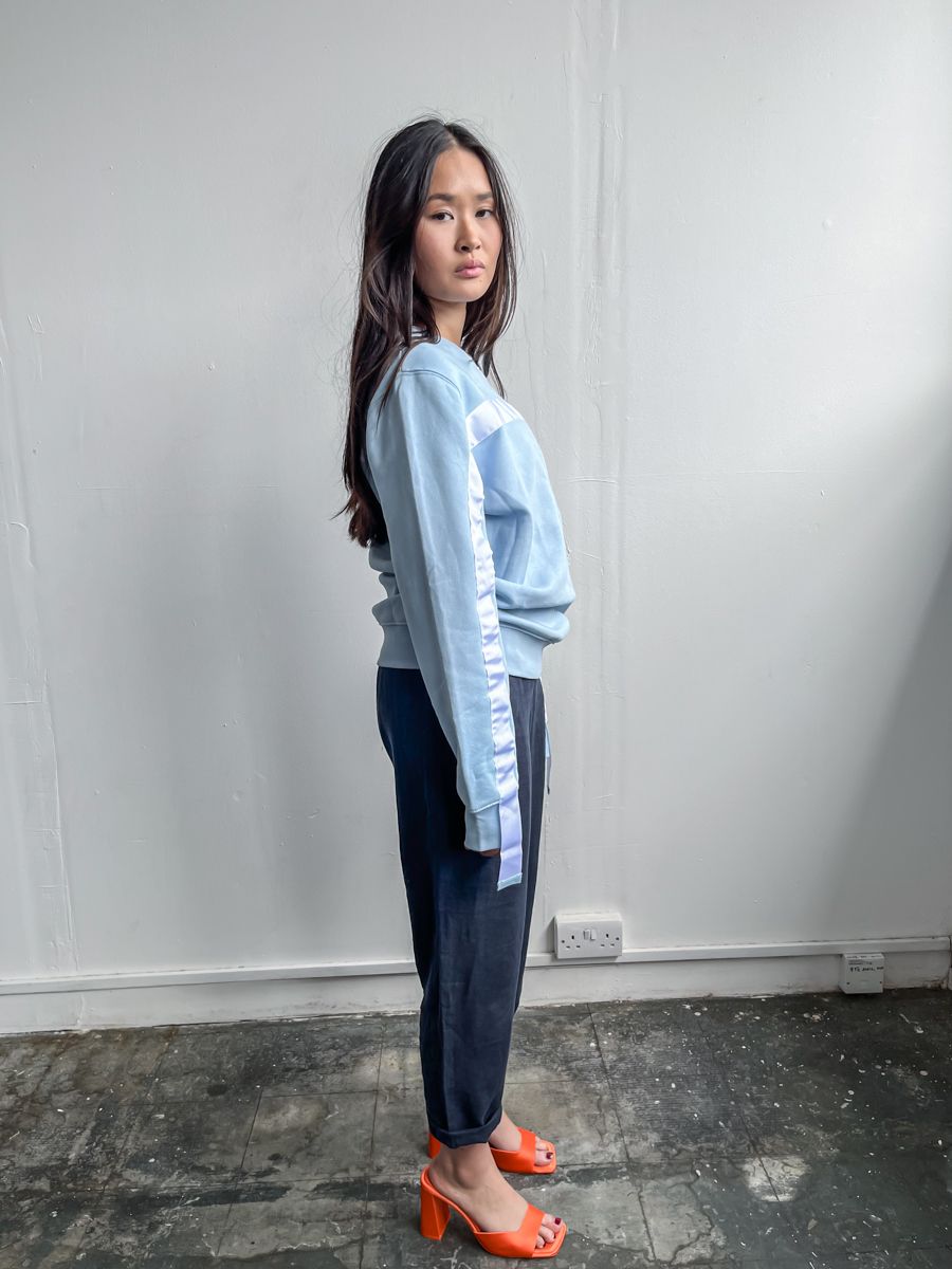 100% Gots certified organic cotton jumper in blue with a white stripe across the chest & down the arms. Made by sustainable clothing brand Fanfare Label.