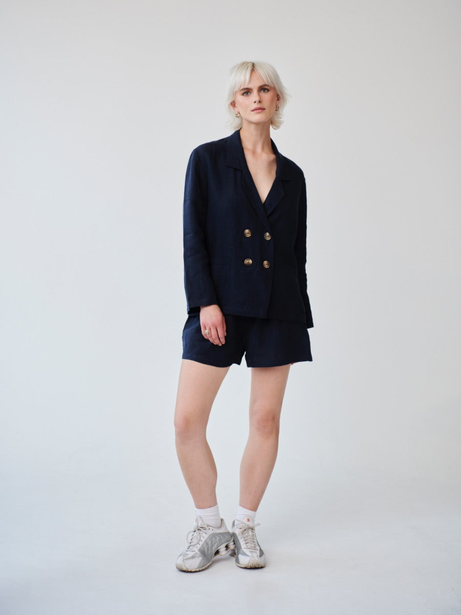 Double breasted Ethically Made Navy Linen Suit with shorts and a high waist. Made by ethical clothing brand Fanfare Label