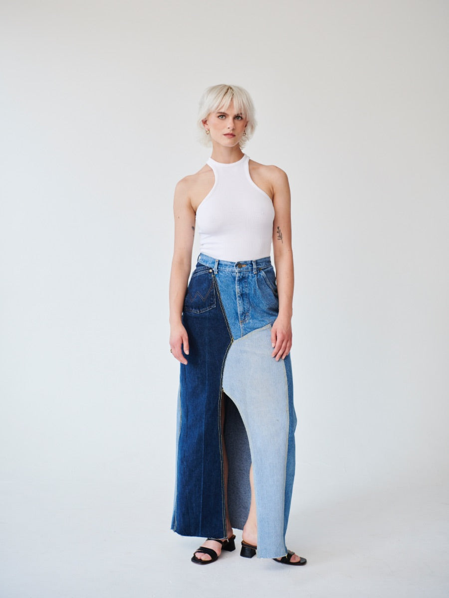 Embrace sustainability with our new upcycled denim maxi skirt. Crafted with love and a commitment to the environment, each skirt tells a unique story while reducing fashion waste.