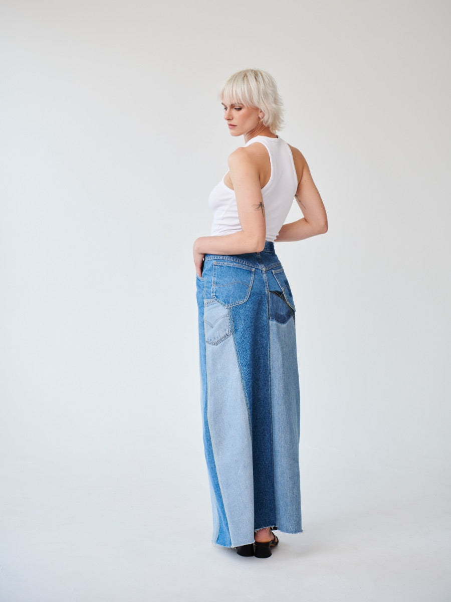 Embrace sustainability with our new upcycled denim maxi skirt. Crafted with love and a commitment to the environment, each skirt tells a unique story while reducing fashion waste.