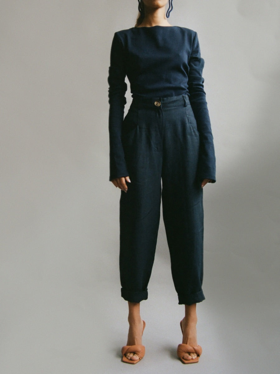 Organic cotton backless navy long sleeved jumper with white tie bow at the back. Fanfare Label Sustainable Clothing