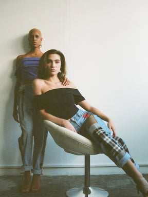 Fanfare Label sustainable women’s clothing brand UK. Our upcycled jeans are high-waisted, blue denim and made from recycled denim. We decorate every jean with a full patchwork design made from recycled materials.