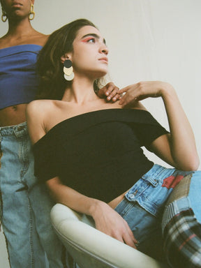 Fanfare Label sustainable women’s clothing brand UK. Our upcycled jeans are high-waisted, blue denim and made from recycled denim. We decorate every jean with a full patchwork design made from recycled materials.