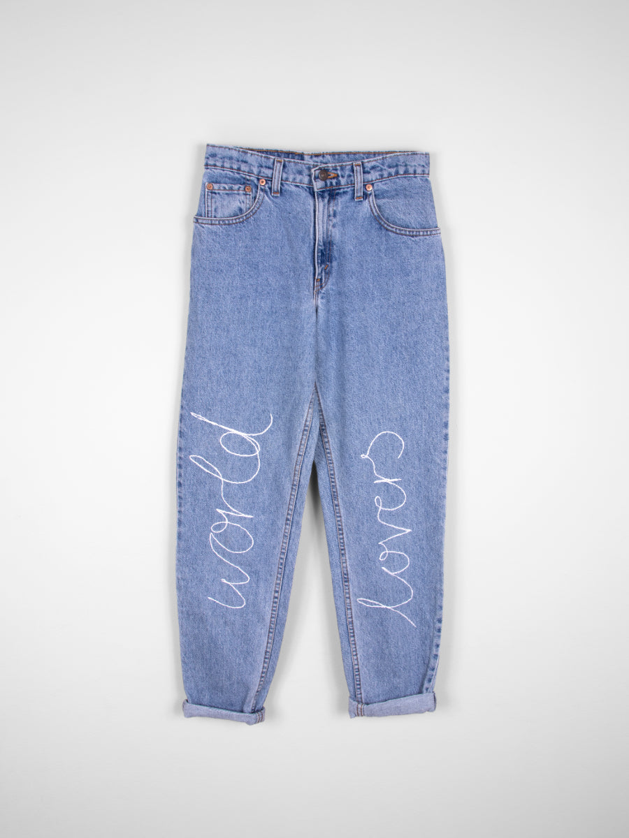 These statement "world lovers" jeans have been hand-embroidered in Fanfare's sustainable London-based studios by local artisans. Created using second-hand jeans, our upcycled collection diverts materials from ending up in landfill.