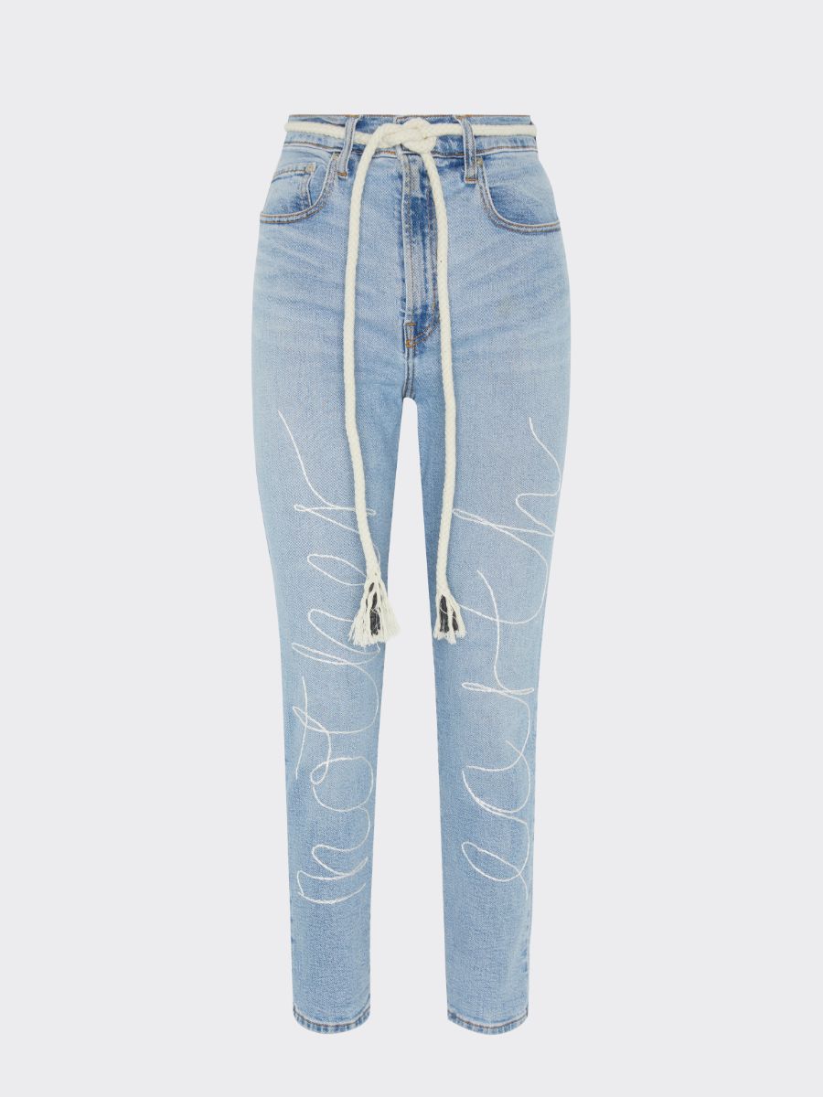 Upcycled jeans embroidered with the words 'Mother Earth'. A one-of-a-kind designer piece handmade in the UK by sustainable womenswear brand Fanfare in our ethical London factories.