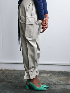 Organic Cotton Beige Utility Cargo Pant with two side pockets & buckles on the ankles. Sustainably made in the UK by ethical clothing brand Fanfare Label Edit alt text